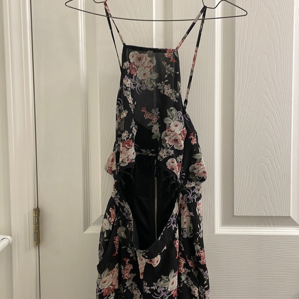 Floral patterned romper semi see-through legs. Crop halter.